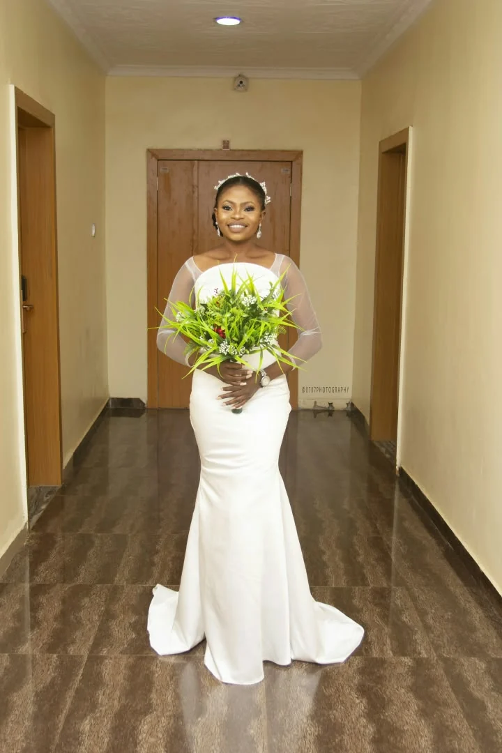 A Del Heph white bridal gown worn by the bride